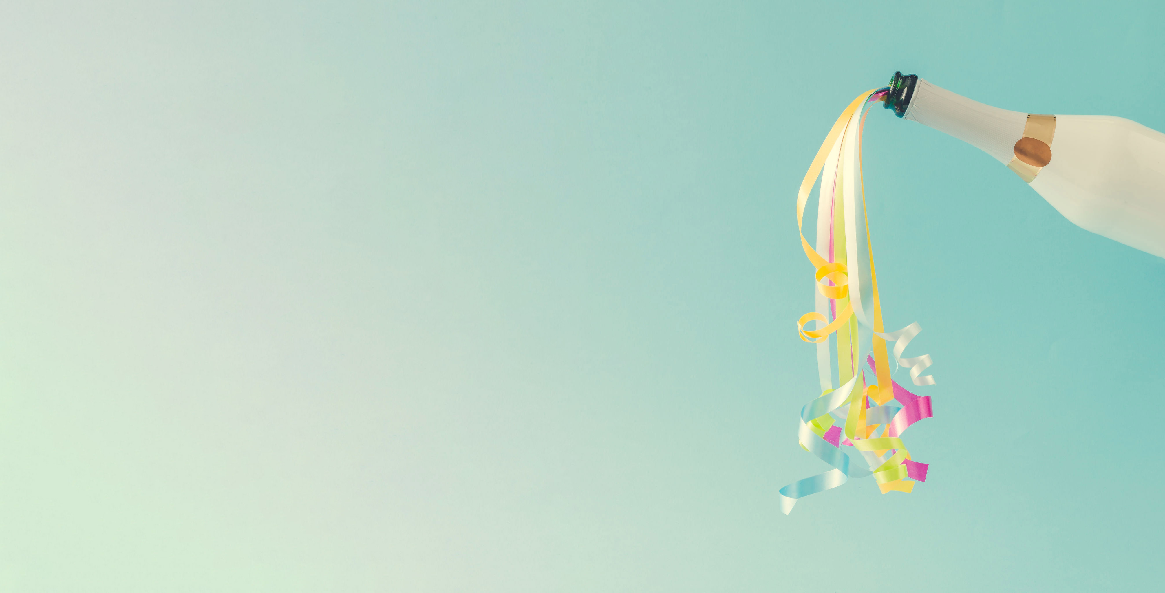 Creative Christmas and New Year composition with champagne bottle, confetti