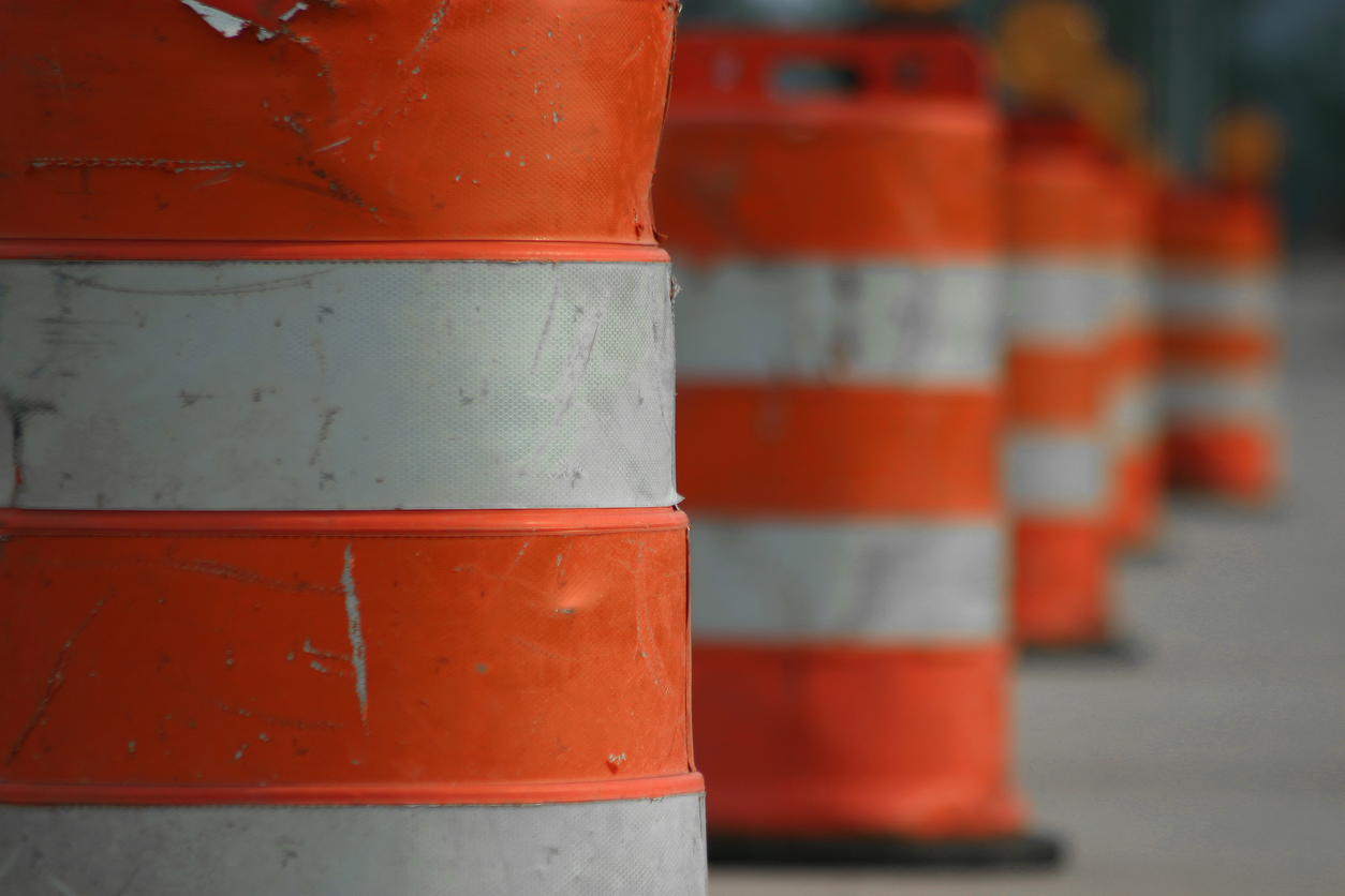 A lane blocked off by orange cones.